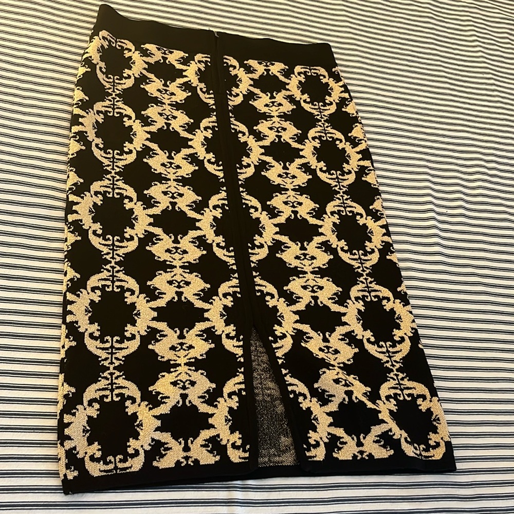 Back zipper pencil skirt with slit down the middle abaut 27”long